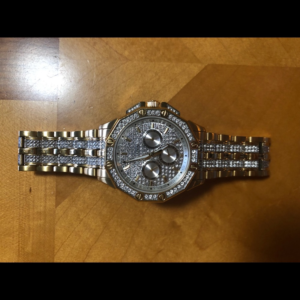 Men’s iced out gold bulova watch.